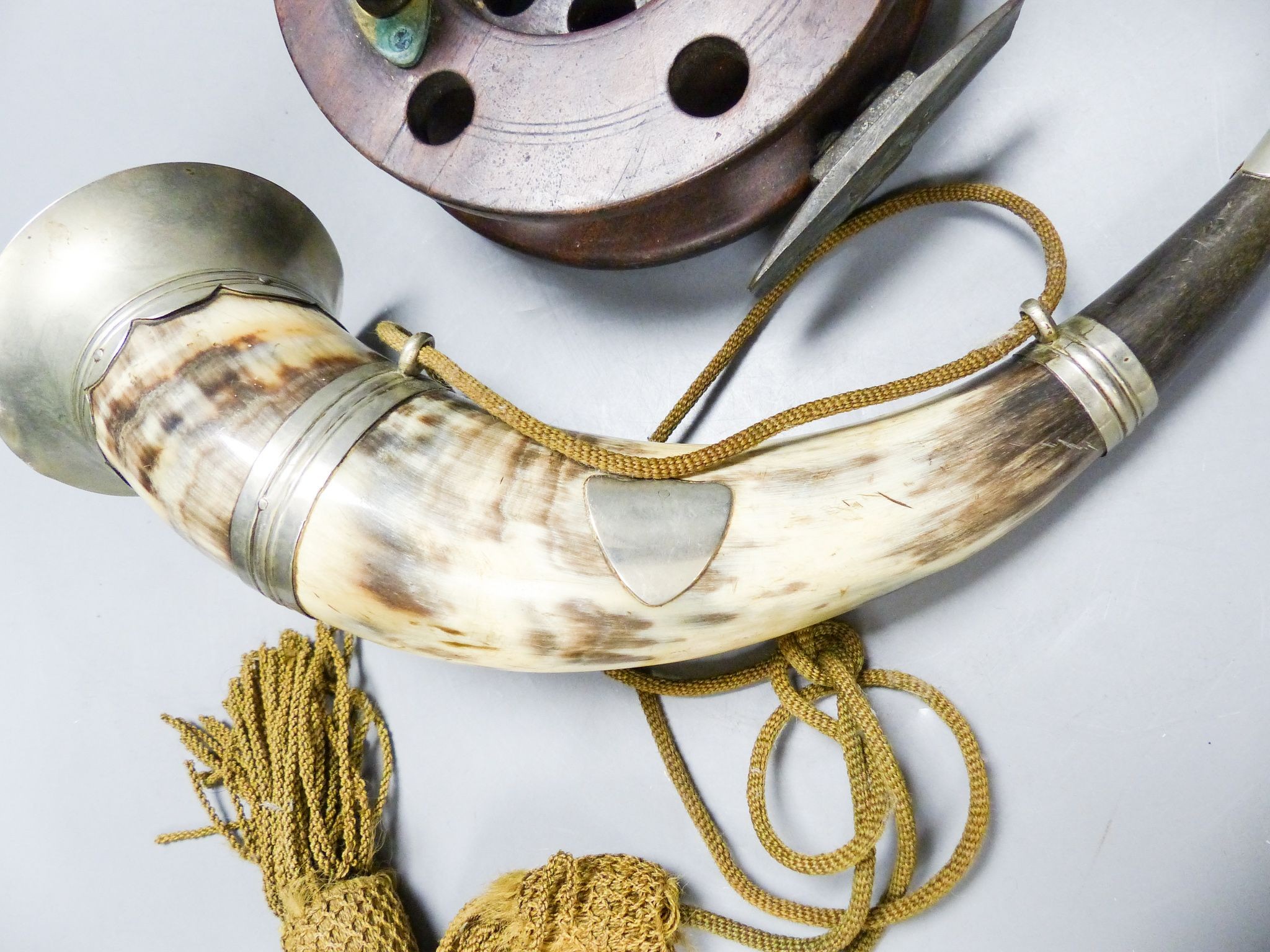 A 19th century Scottish plate-mounted hunting horn and an antique wooden fishing reel